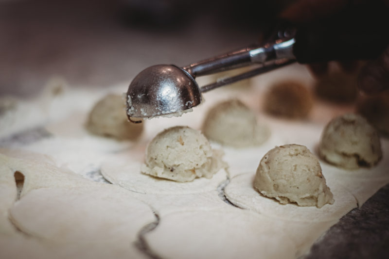 making pierogi scooping filling balls