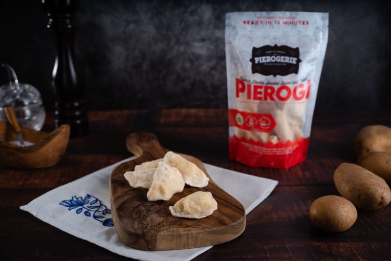 Frozen Double Smoked Bacon and Potato Pierogi with product bag in the background
