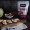 Sauerkraut and Portobello Mushroom Pierogi with product bag in the background