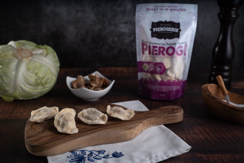 Sauerkraut and Portobello Mushroom Pierogi with product bag in the background