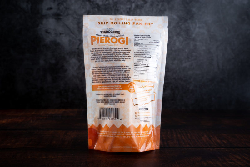 A bag of Cheddar Cheese and Potato Pierogi showing the back