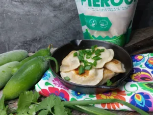 Jalapeño and Cheddar pierogi in a bag and on a cast iron frying pan